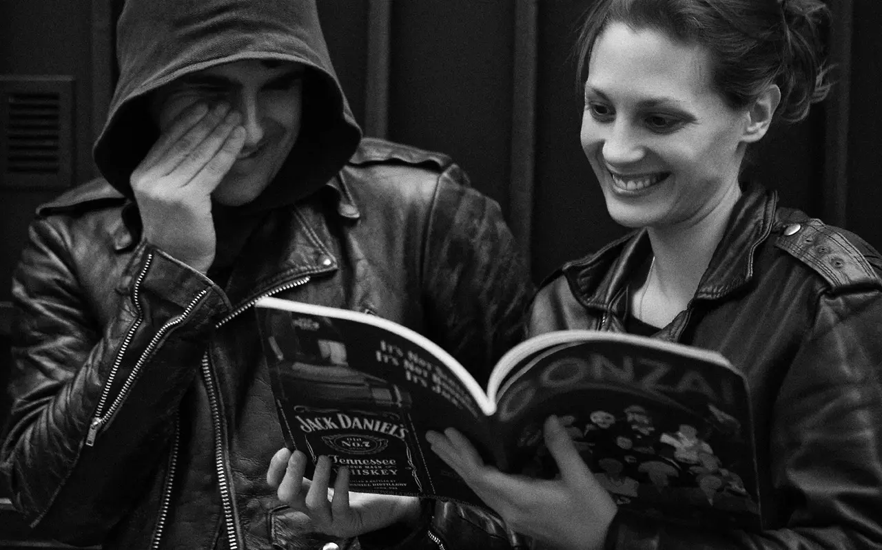 Black Rebel Motorcycle Club reading a magazine